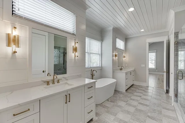 a view of a kitchen with a sink and cabinets