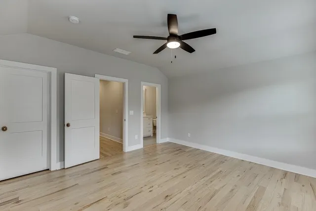 an aerial view of a house with garden space ocean view