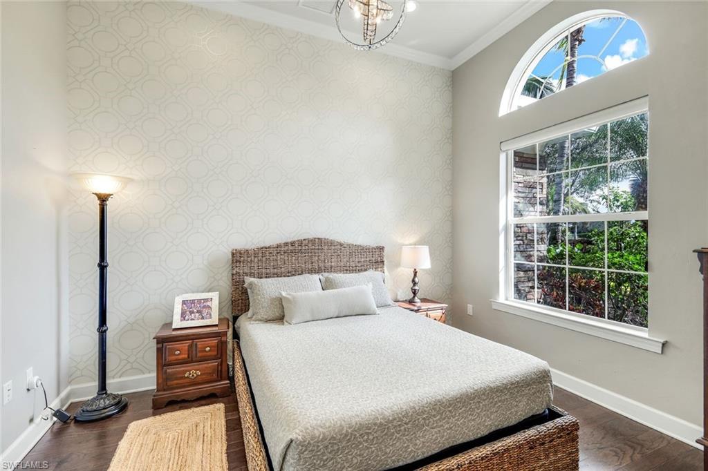 9075 Breakwater Drive Naples, FL 34120 - Photo 18 of 48 a bedroom with a bed and a window
