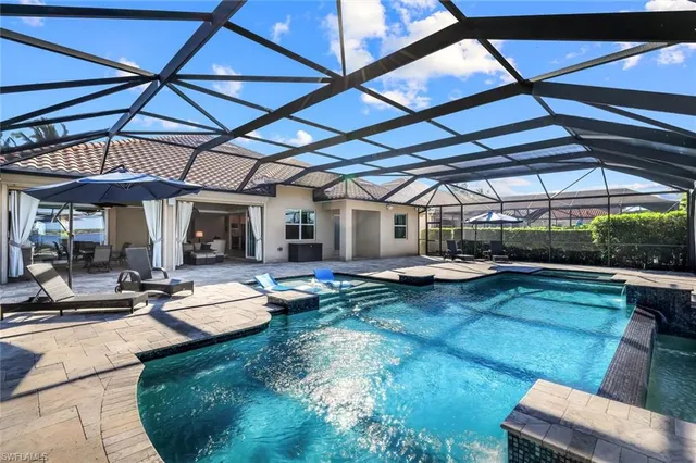 a view of a swimming pool with a patio
