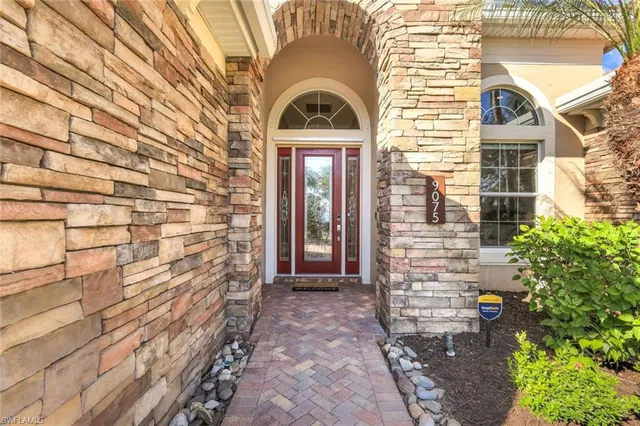 a front view of a house with large windows