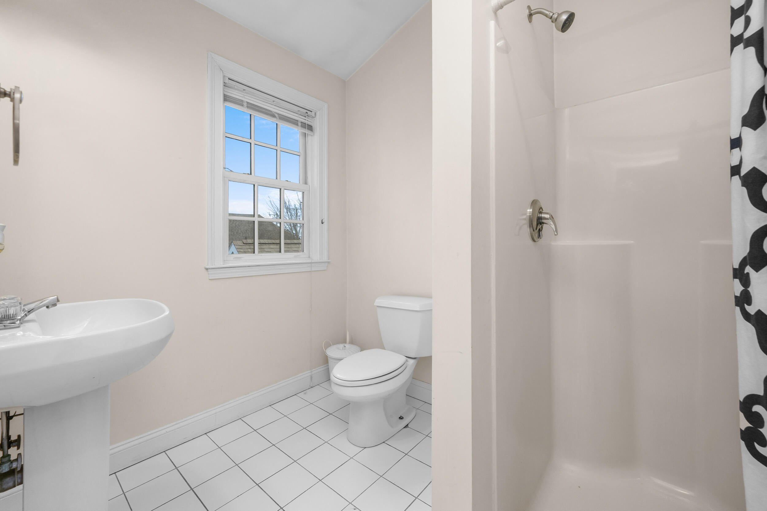 615 Main Street, Unit 3 Hyannis, MA 02601 - Photo 12 of 22 a bathroom with a sink toilet and shower