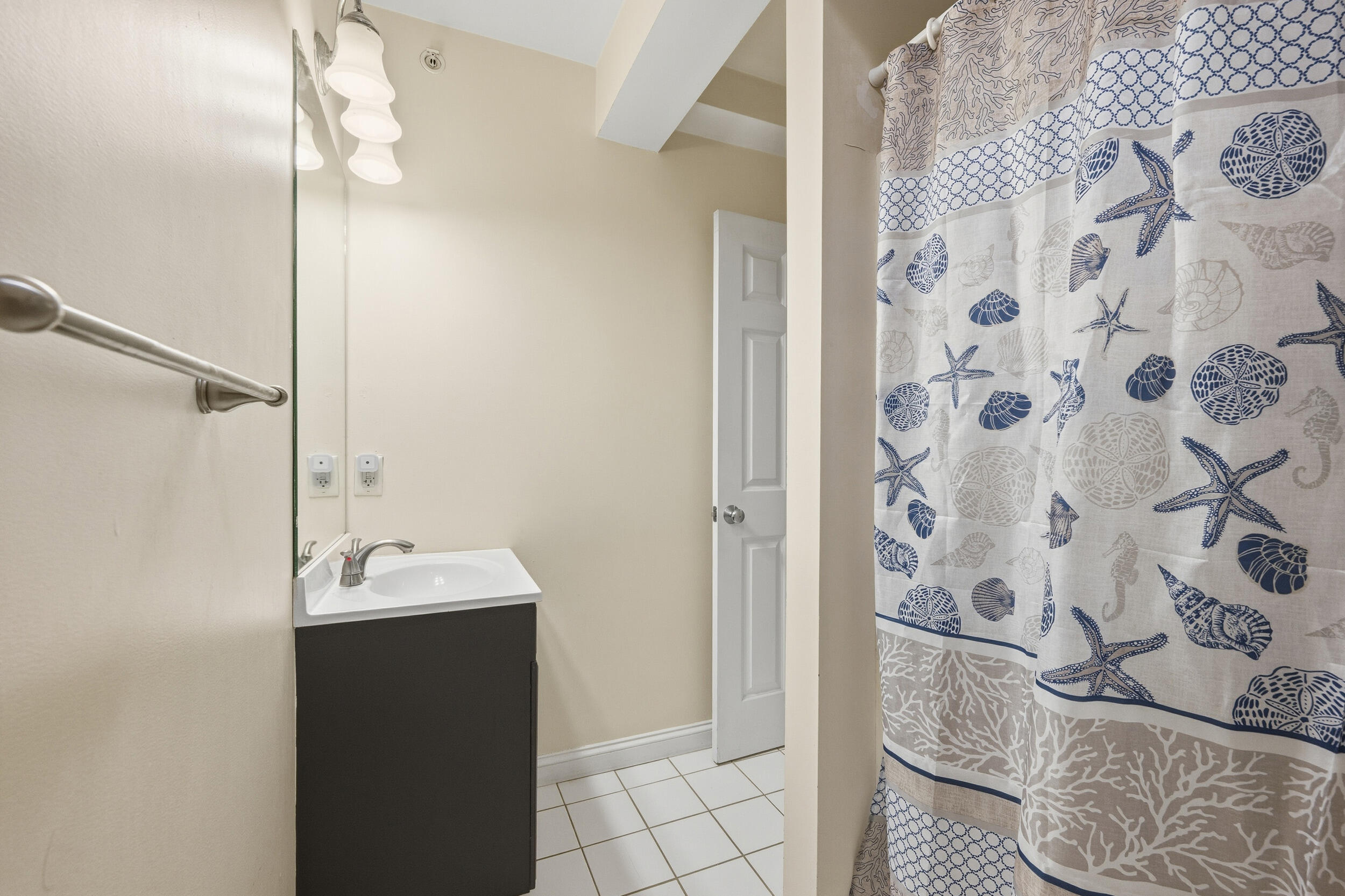 615 Main Street, Unit 3 Hyannis, MA 02601 - Photo 19 of 22 a bathroom with a sink and mirror