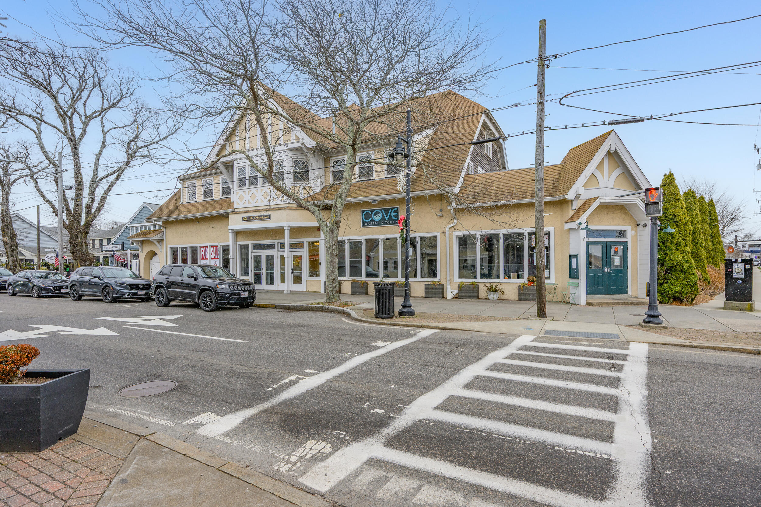 615 Main Street, Unit 3 Hyannis, MA 02601 - Photo 2 of 22 a front view of a house with a fire pit and outdoor space