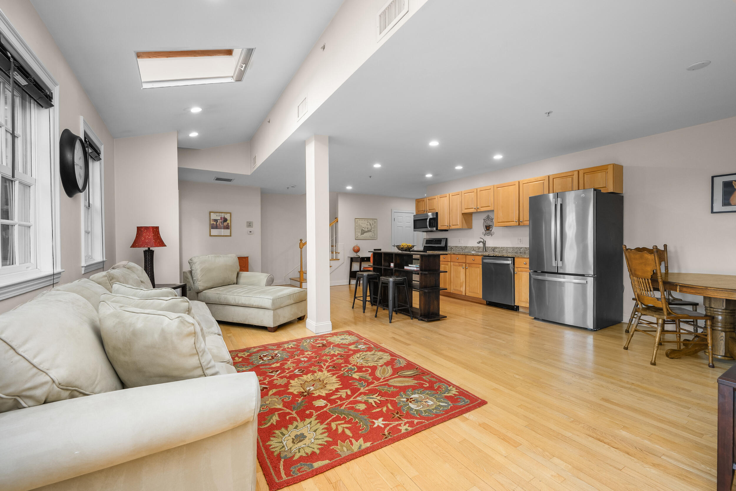 615 Main Street, Unit 3 Hyannis, MA 02601 - Photo 7 of 22 a living room with furniture kitchen and a table