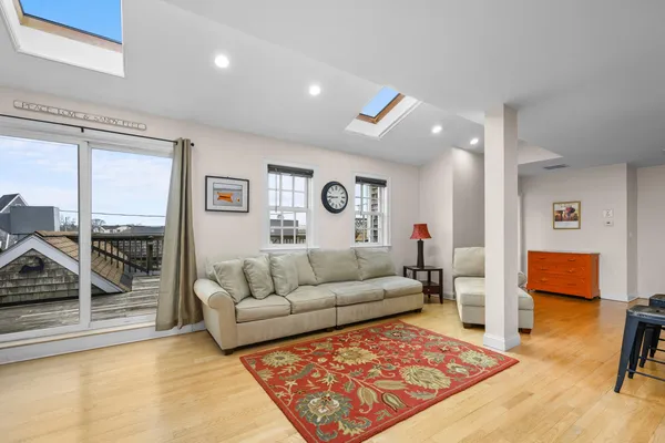 a living room with furniture and a rug