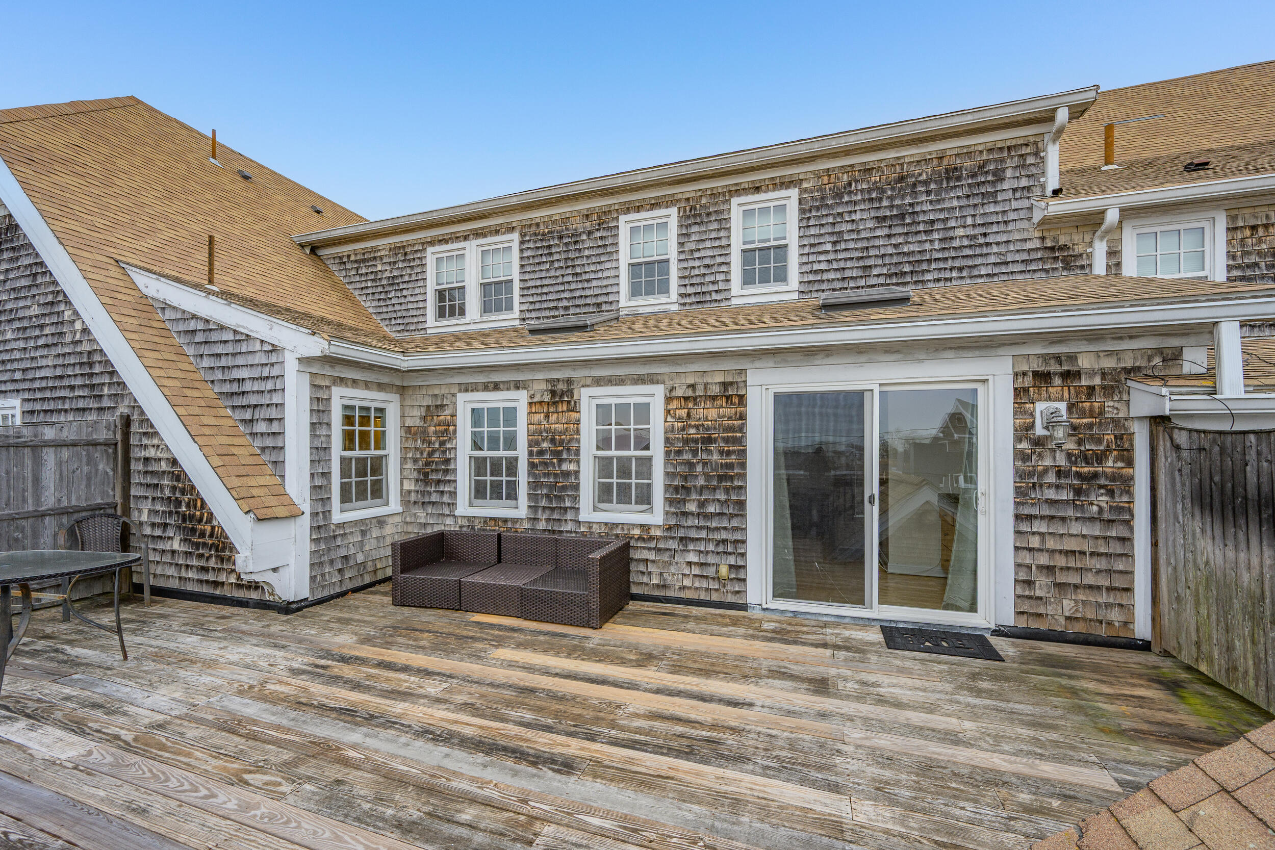 615 Main Street, Unit 3 Hyannis, MA 02601 - Photo 9 of 22 a front view of a house with a yard