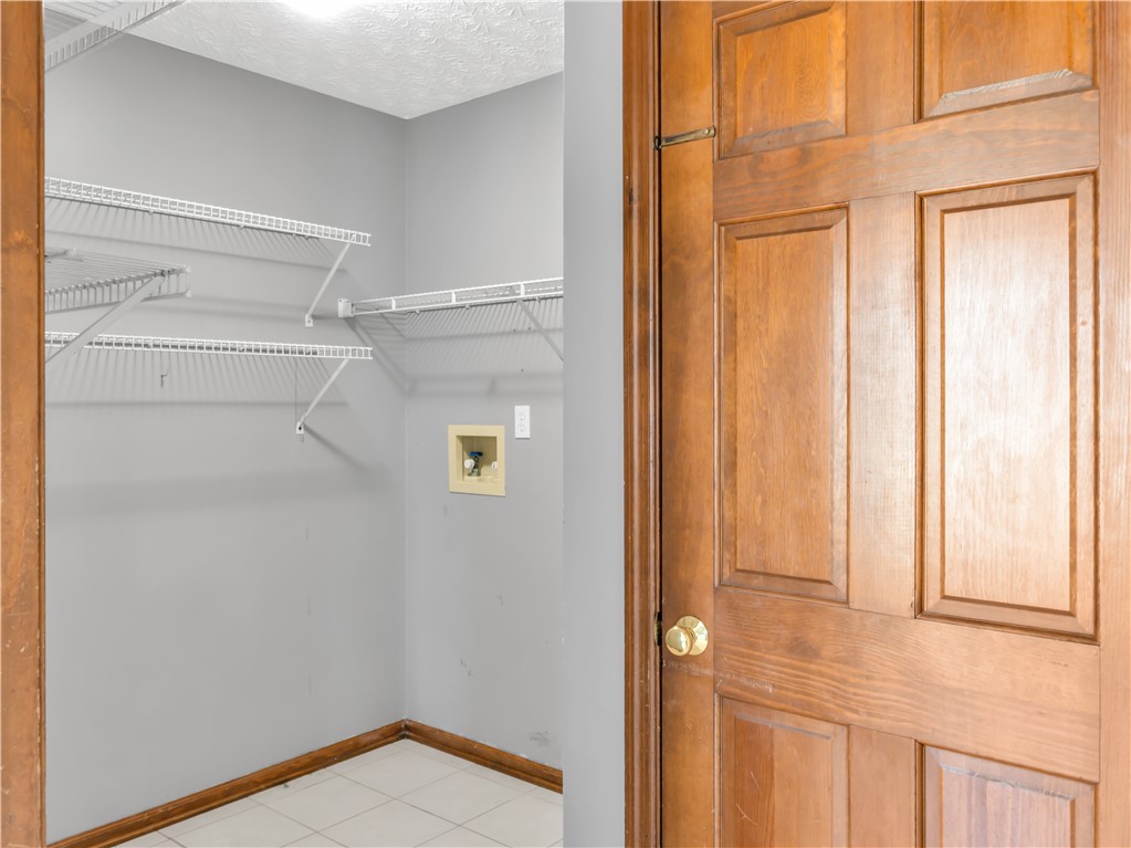 25 Callaway Springboro, OH 45066 - Photo 15 of 51 Functional utility room with wire shelving and durable tile flooring awaits customization.