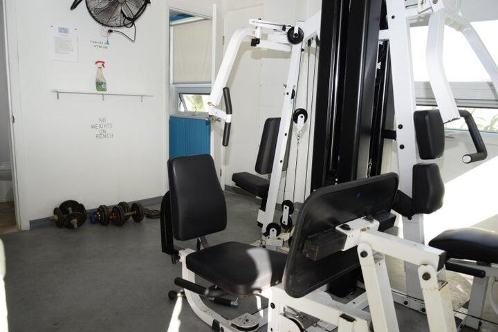 55 Boca Chica Road, Unit 93 Key West, FL 33040 - Photo 15 of 21 a view of gym equipment with wooden floor
