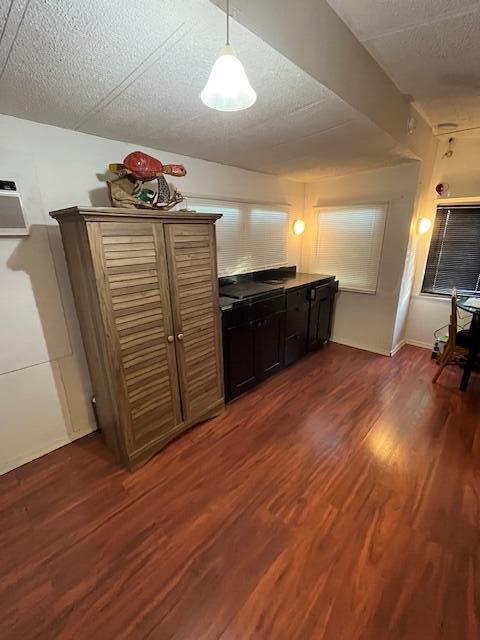 55 Boca Chica Road, Unit 93 Key West, FL 33040 - Photo 5 of 21 a kitchen with granite countertop white cabinets and wooden floor