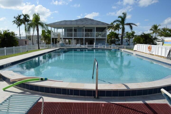 55 Boca Chica Road, Unit 93 Key West, FL 33040 - Photo 10 of 21 a view of a swimming pool with a patio