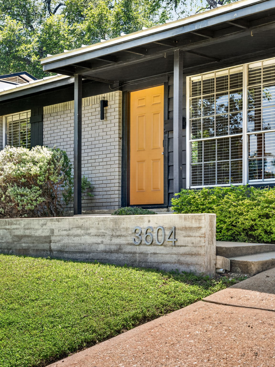 3604 Wilson Street Austin, TX 78704 - Photo 3 of 25 a front view of a house with a yard