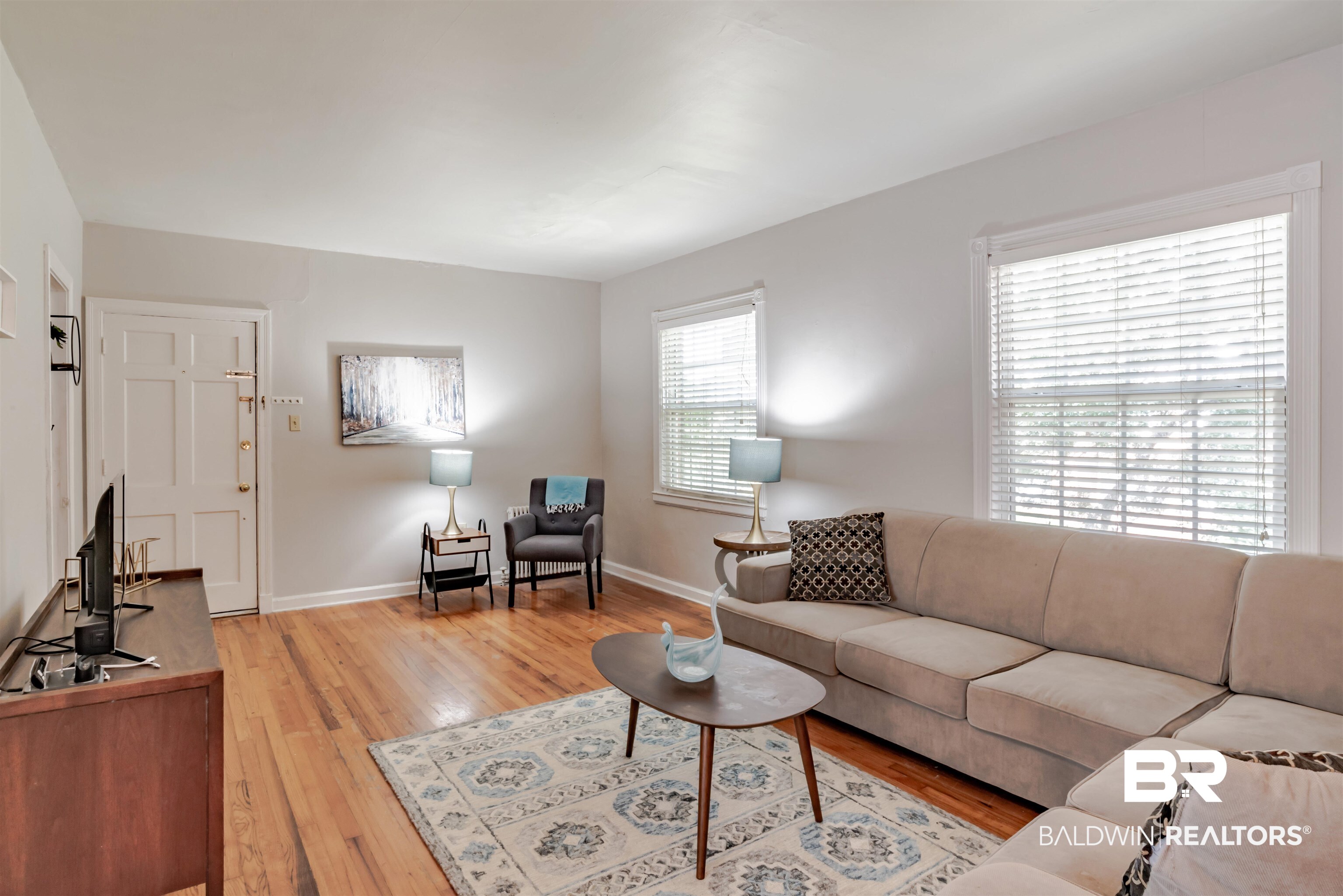 214 Upham Street, Unit 7C Mobile, AL 36607 - Photo 2 of 32 Living room with light wood-style floors and baseboards