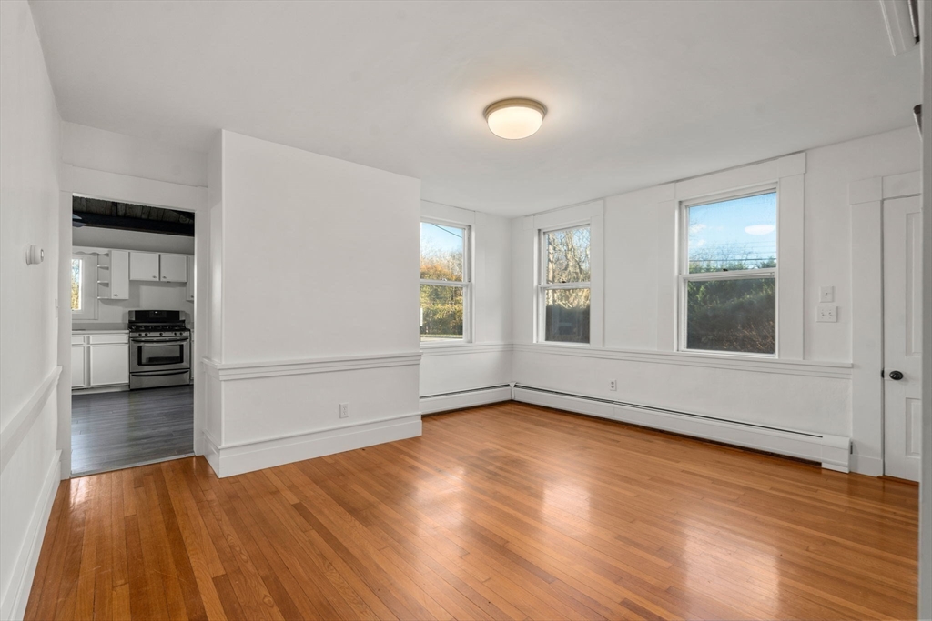 83 Fairhaven Road Mattapoisett, MA 02739 - Photo 18 of 41 wooden floor in an empty room with a window