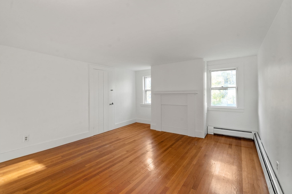 83 Fairhaven Road Mattapoisett, MA 02739 - Photo 24 of 41 an empty room with wooden floor and windows