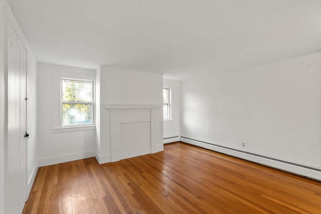 83 Fairhaven Road Mattapoisett, MA 02739 - Photo 28 of 41 an empty room with wooden floor and windows