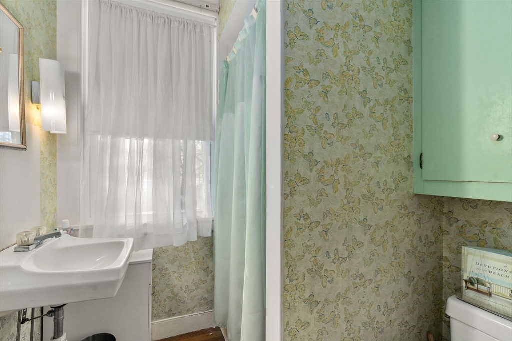 83 Fairhaven Road Mattapoisett, MA 02739 - Photo 8 of 41 a bathroom with a sink and a mirror