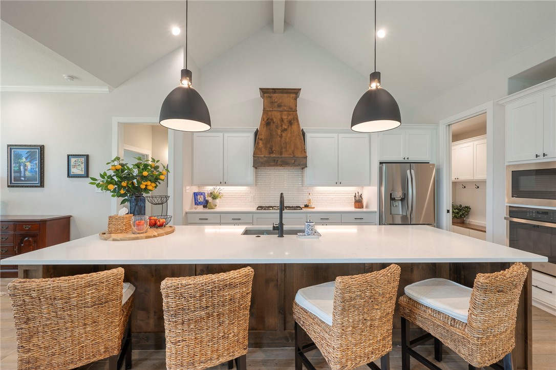 5019 Grayson Way Bryan, TX 77802 - Photo 6 of 26 Gleaming quartz counters offer lots of prep space.