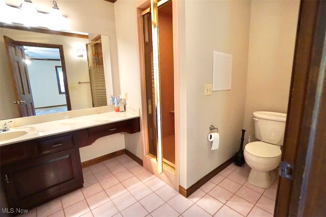 1760 Chartley Road Gates Mills, OH 44040 - Photo 17 of 49 Full bath featuring light tile patterned floors, vanity, and a stall shower