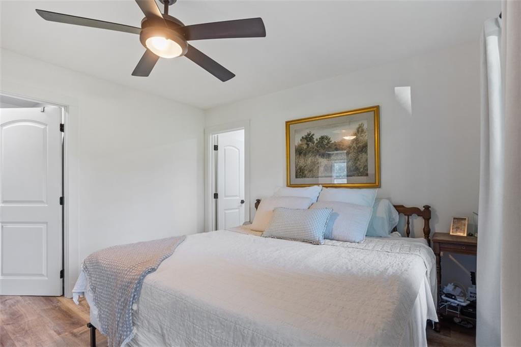 172 Jasper Street Fairmount, GA 30139 - Photo 14 of 32 a bedroom with a large bed and a painting on the wall