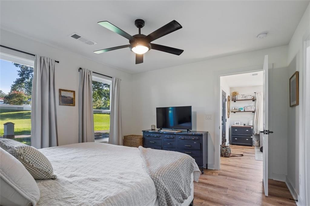 172 Jasper Street Fairmount, GA 30139 - Photo 17 of 32 a bedroom with a bed and a flat screen tv