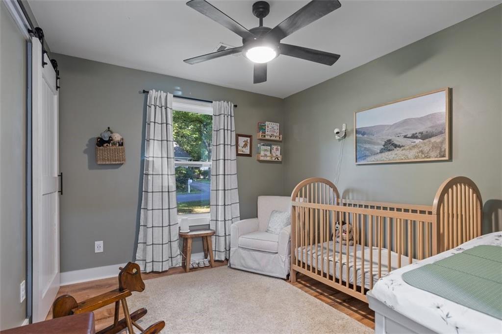 172 Jasper Street Fairmount, GA 30139 - Photo 18 of 32 a bedroom with furniture and windows