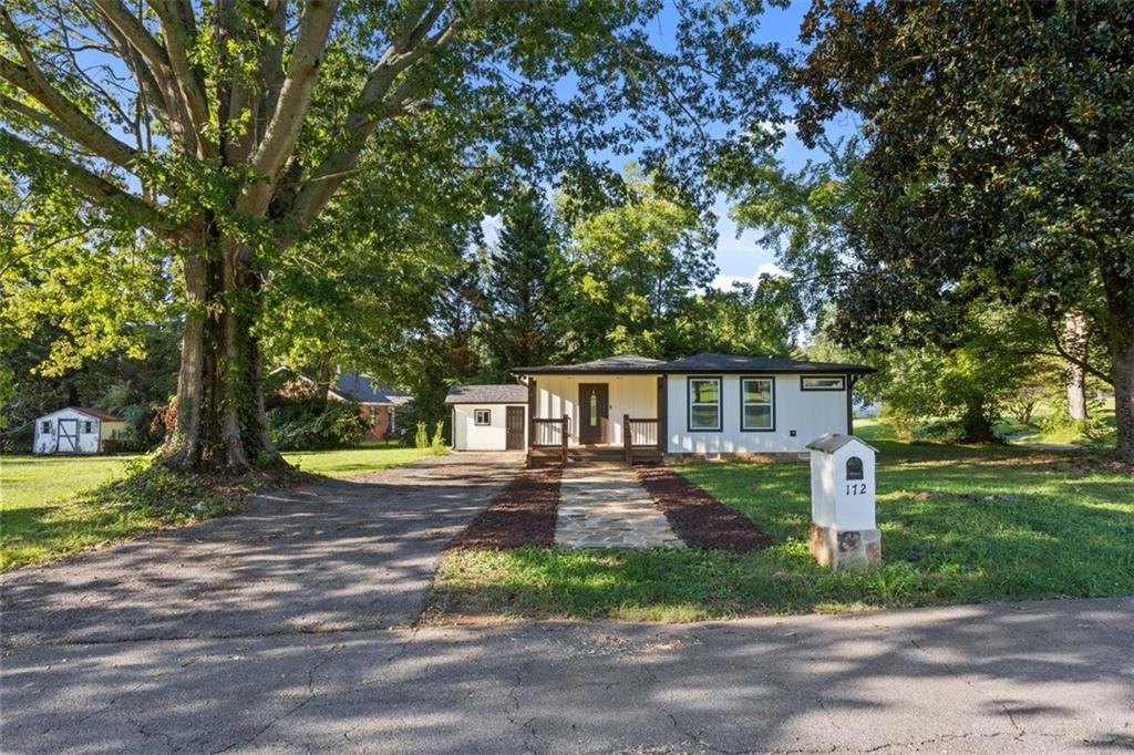 172 Jasper Street Fairmount, GA 30139 - Photo 2 of 32 a front view of a house with yard and green space