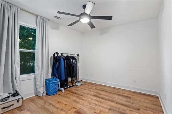a view of a room with gym equipment and a window