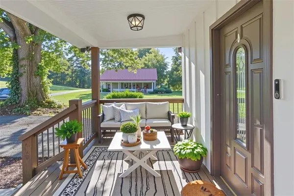 a view of balcony with furniture