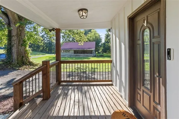 a view of a two chairs in the balcony