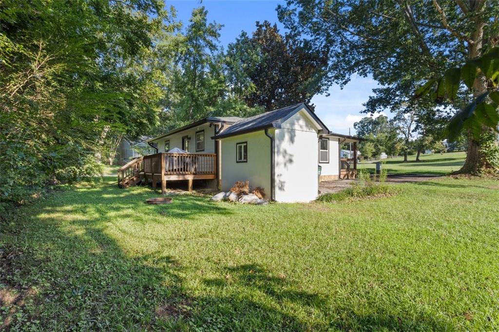 172 Jasper Street Fairmount, GA 30139 - Photo 29 of 32 a view of a house with yard and a garden