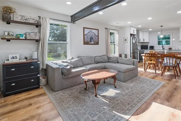 a living room with furniture and a table