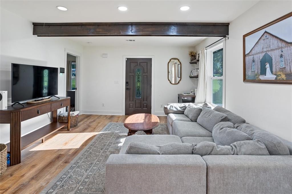 172 Jasper Street Fairmount, GA 30139 - Photo 6 of 32 a living room with furniture and a flat screen tv