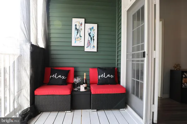 a outdoor sitting area with furniture