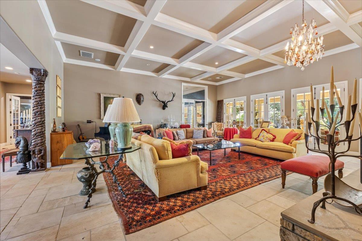 2727 Thomas Road Hollister, CA 95023 - Photo 12 of 83 a living room with furniture a chandelier and a large window