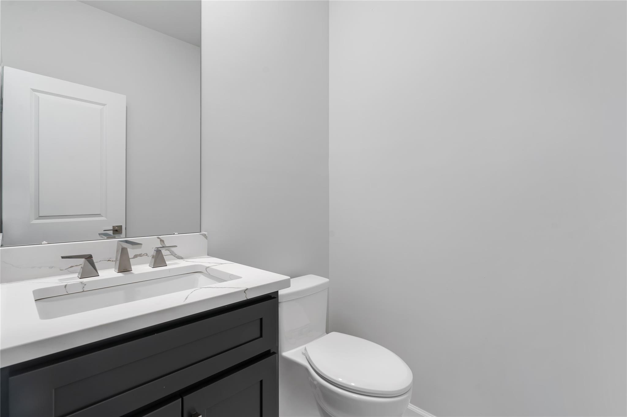 346 Old Hopewell Road Wappingers Falls, NY 12590 - Photo 17 of 42 a bathroom with a sink a toilet and mirror