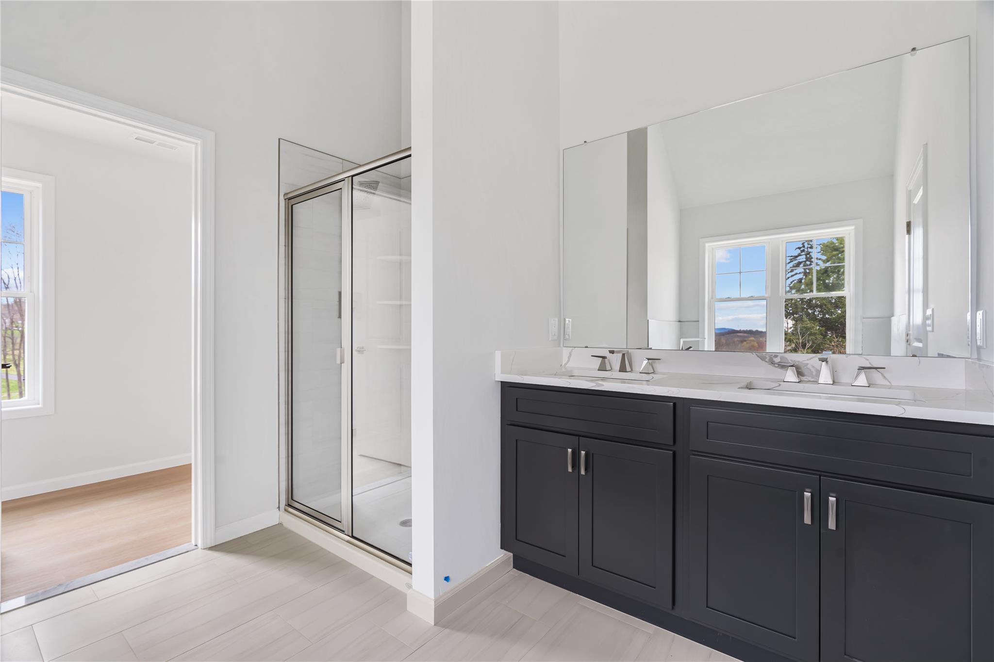 346 Old Hopewell Road Wappingers Falls, NY 12590 - Photo 22 of 42 a bathroom with a double vanity sink and mirror
