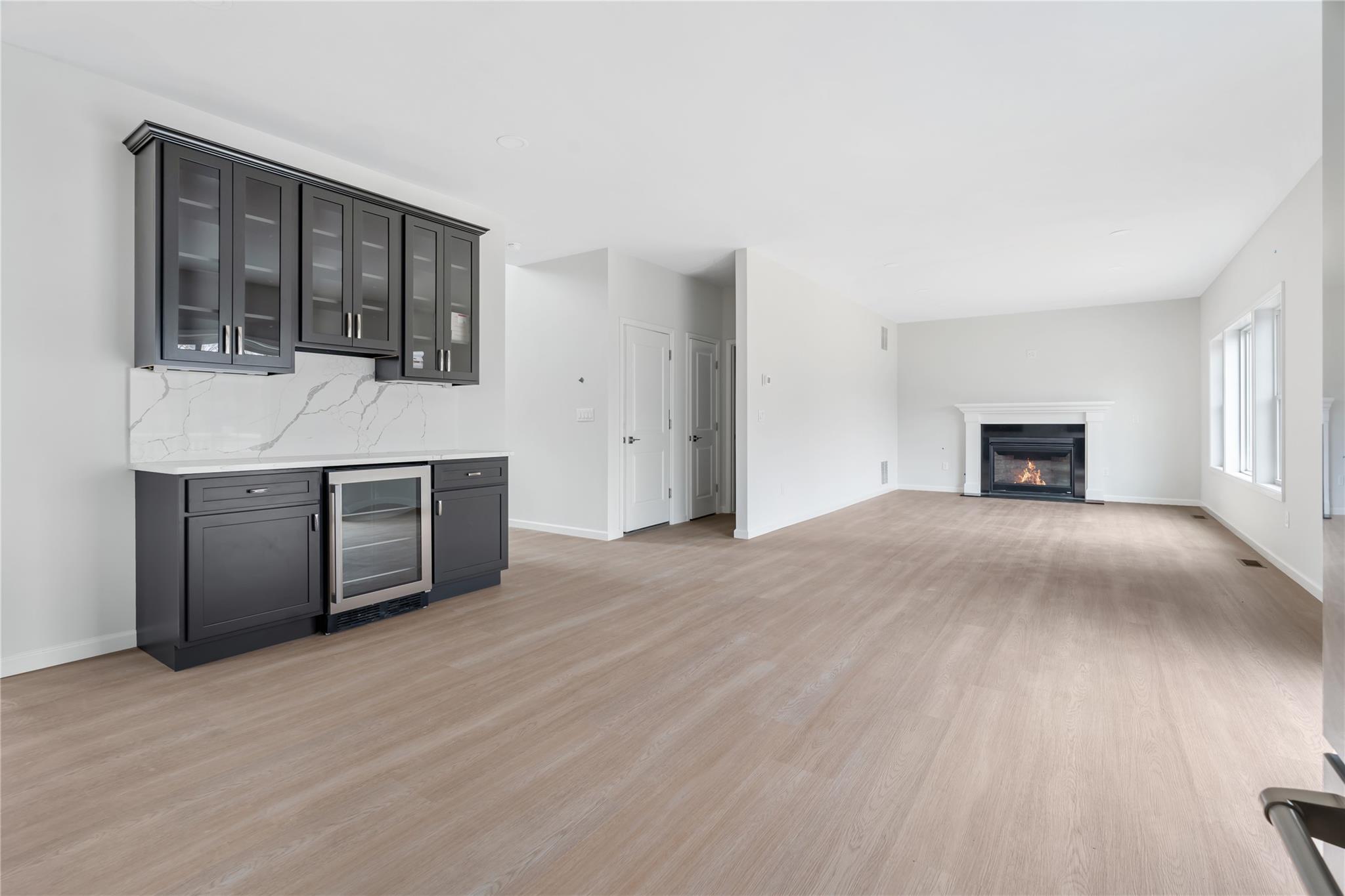 346 Old Hopewell Road Wappingers Falls, NY 12590 - Photo 10 of 42 a view of empty room with a fireplace and wooden floor