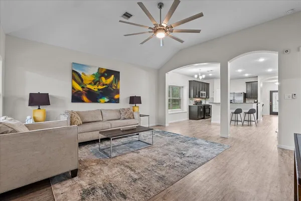 a living room with furniture and a flat screen tv