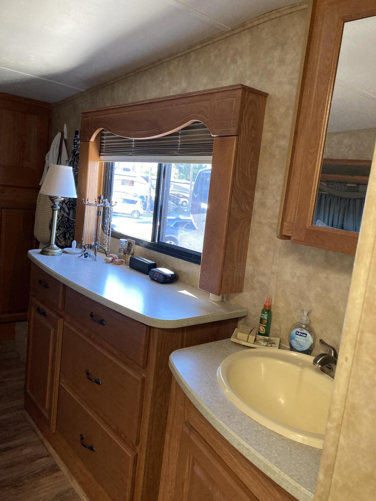 69411 Ramon Road, Unit 61 Cathedral City, CA 92234 - Photo 12 of 14 a bathroom with a sink and a mirror