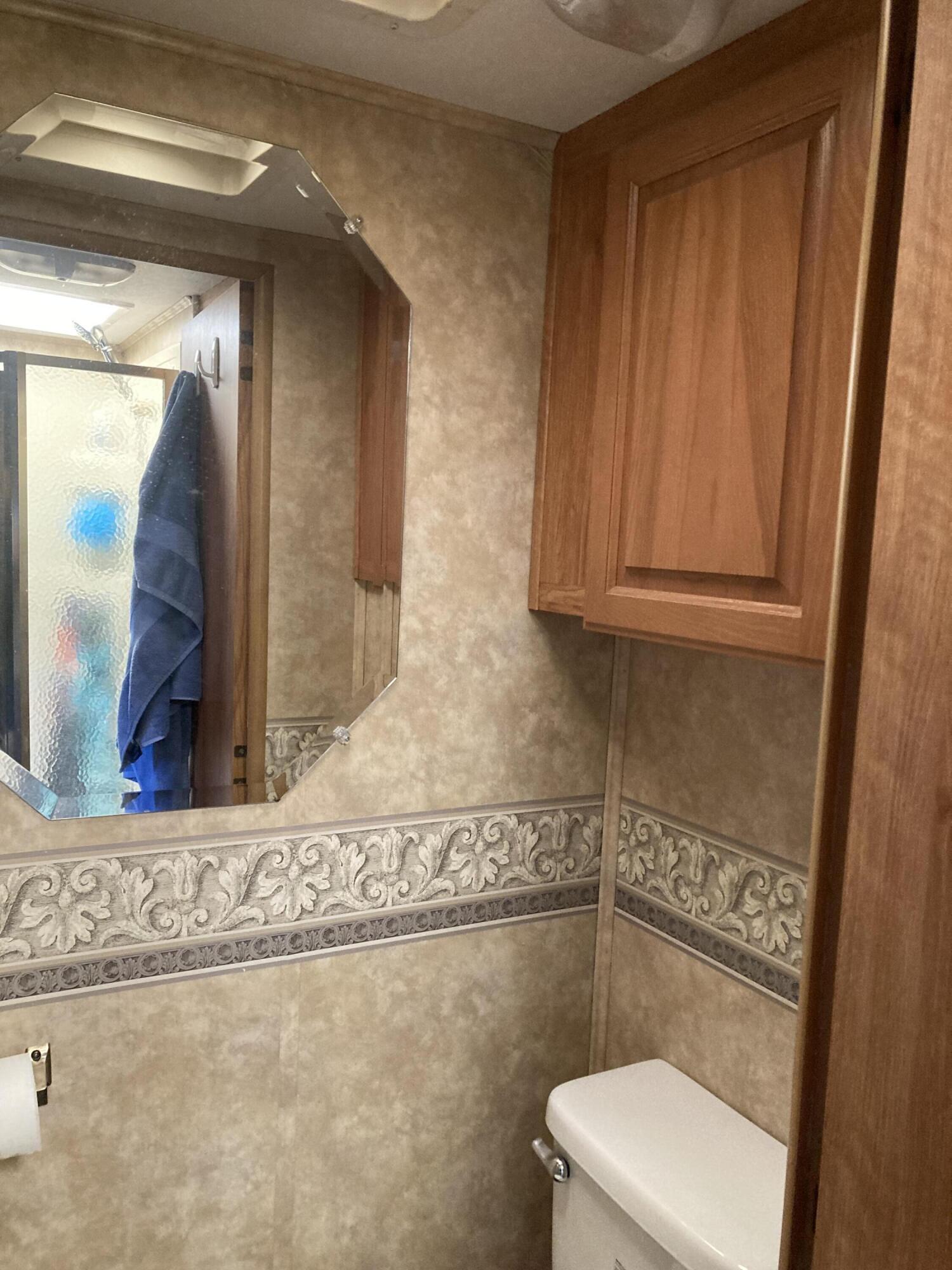 69411 Ramon Road, Unit 61 Cathedral City, CA 92234 - Photo 13 of 14 a bathroom with a toilet and a sink