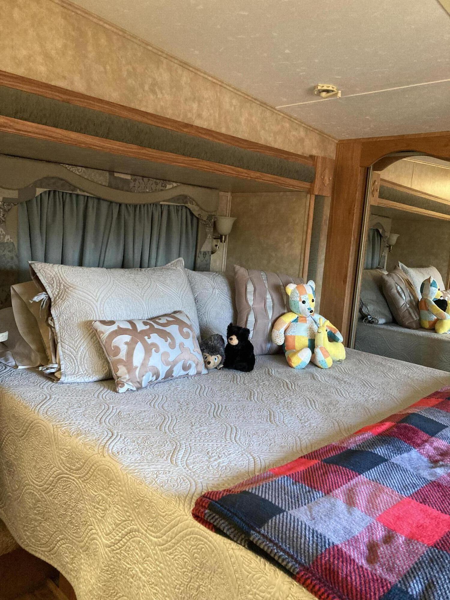 69411 Ramon Road, Unit 61 Cathedral City, CA 92234 - Photo 14 of 14 a bedroom with bed and a couch