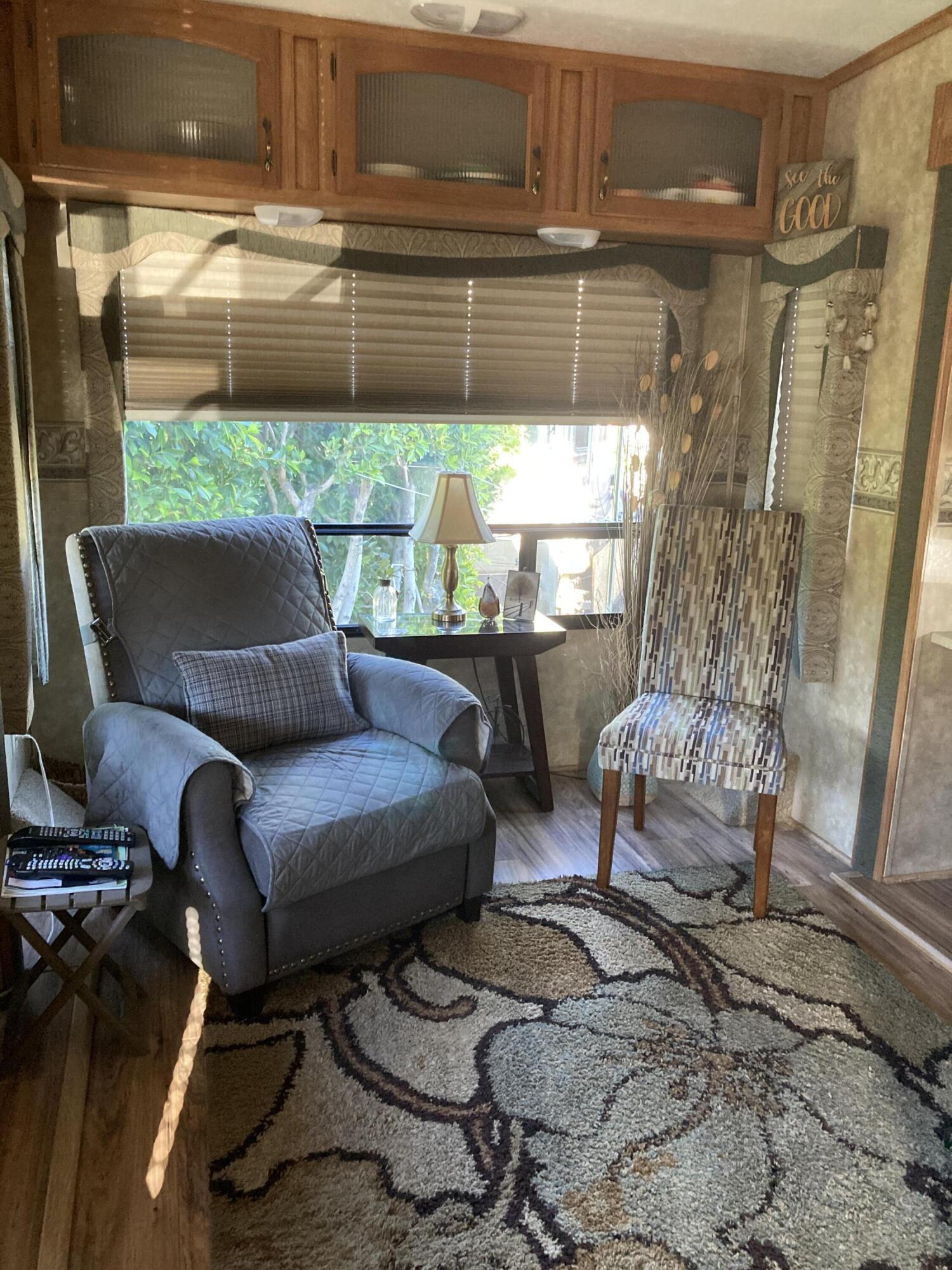 69411 Ramon Road, Unit 61 Cathedral City, CA 92234 - Photo 8 of 14 a living room with furniture and a window