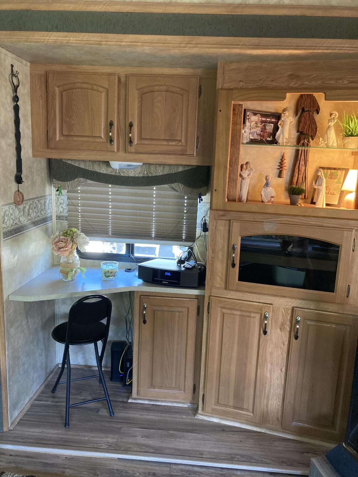69411 Ramon Road, Unit 61 Cathedral City, CA 92234 - Photo 10 of 14 a kitchen with a stove and a cabinets