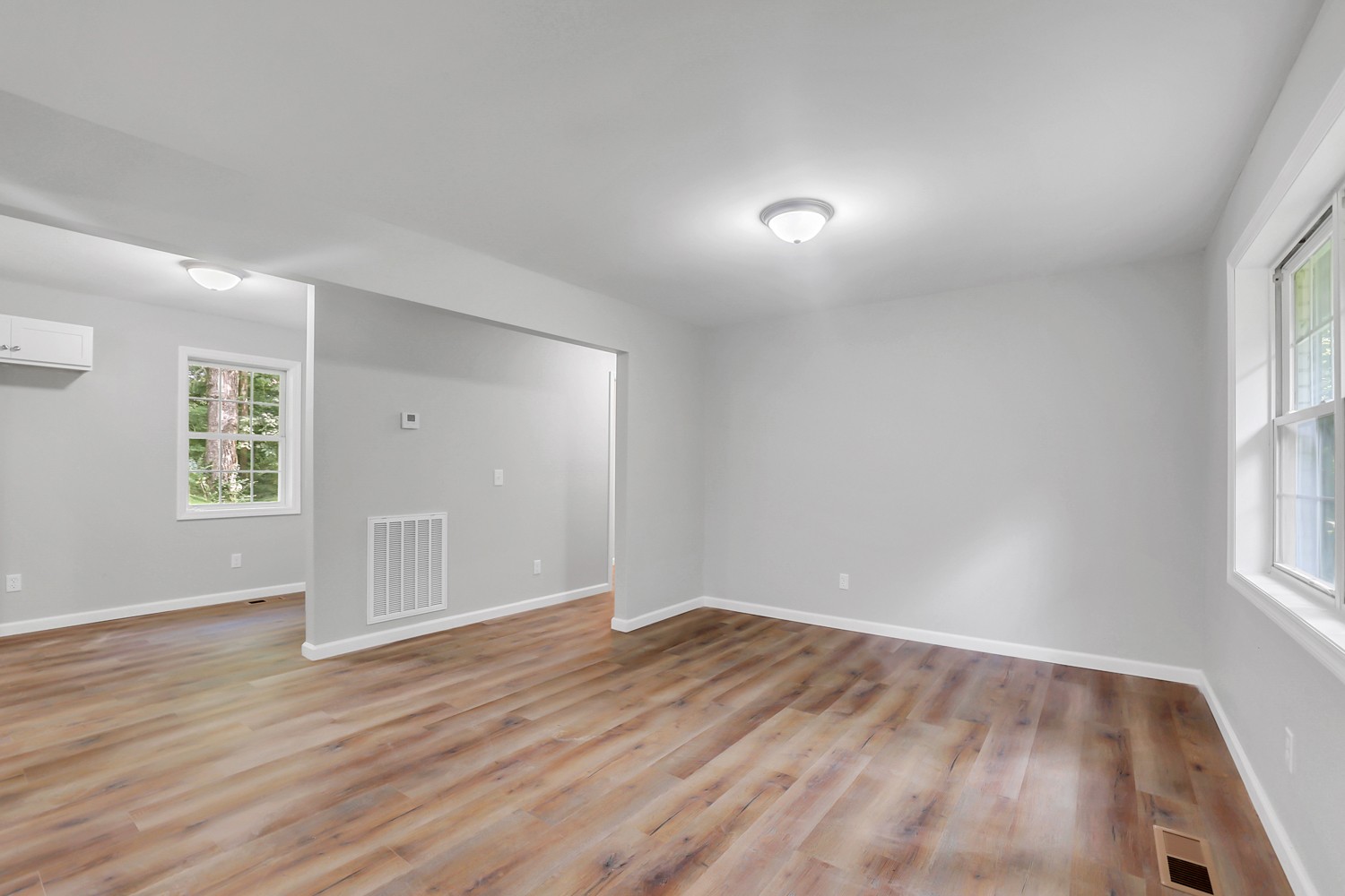 827 Spring Street Red Boiling Springs, TN 37150 - Photo 14 of 25 an empty room with wooden floor and windows