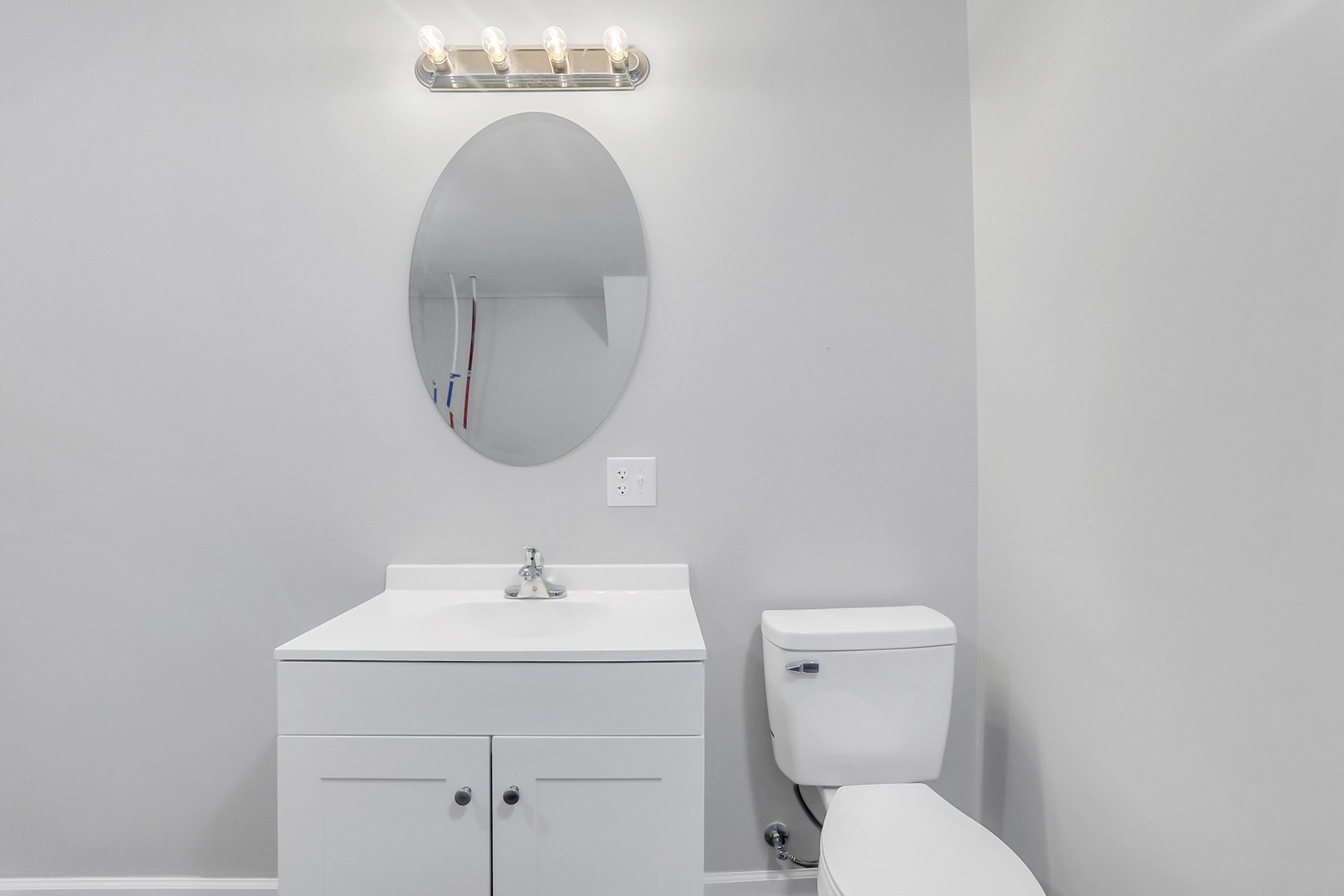 827 Spring Street Red Boiling Springs, TN 37150 - Photo 18 of 25 a bathroom with a toilet sink and mirror