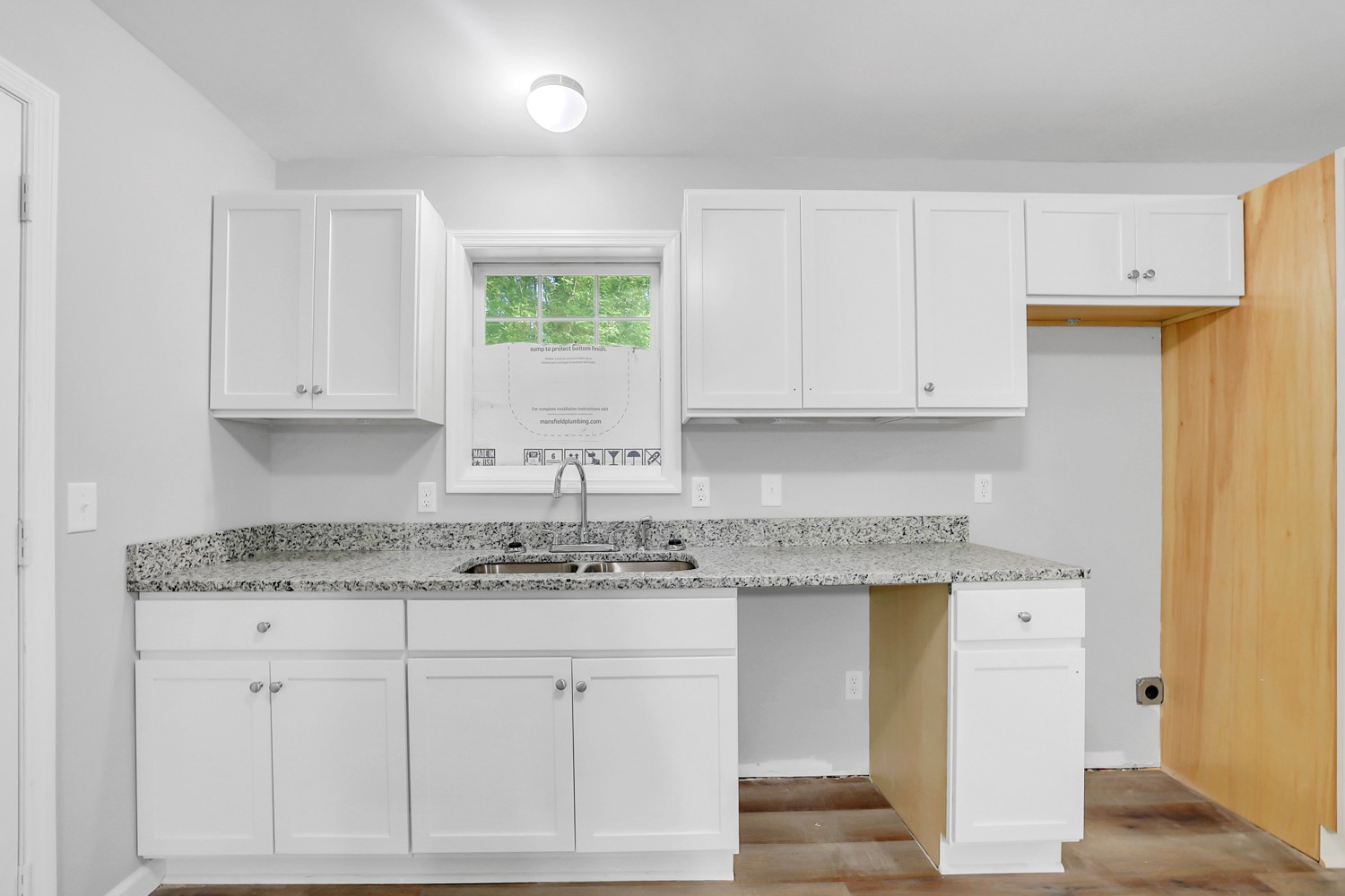 827 Spring Street Red Boiling Springs, TN 37150 - Photo 6 of 25 a kitchen with stainless steel appliances granite countertop a sink and cabinets with wooden floor