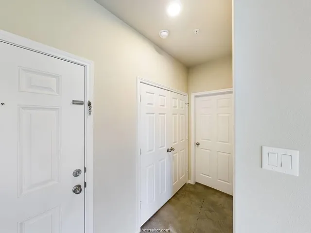a view of a hallway with closet