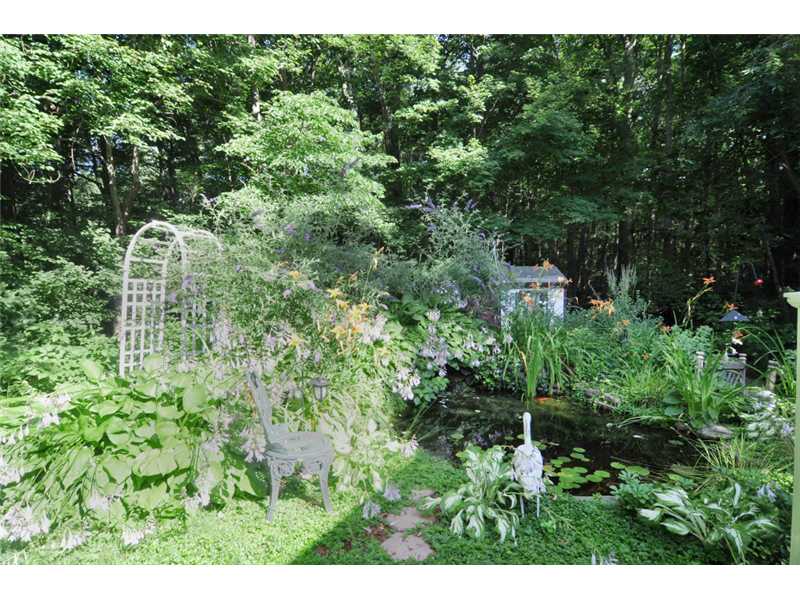 73 Charles Harpin Road Scituate, RI 02825 - Photo 20 of 24 Yard/Garden. Tranquil Koi Pond surrounded by lush perennial garden provides a scenic spot to sit and enjoy the back yard.