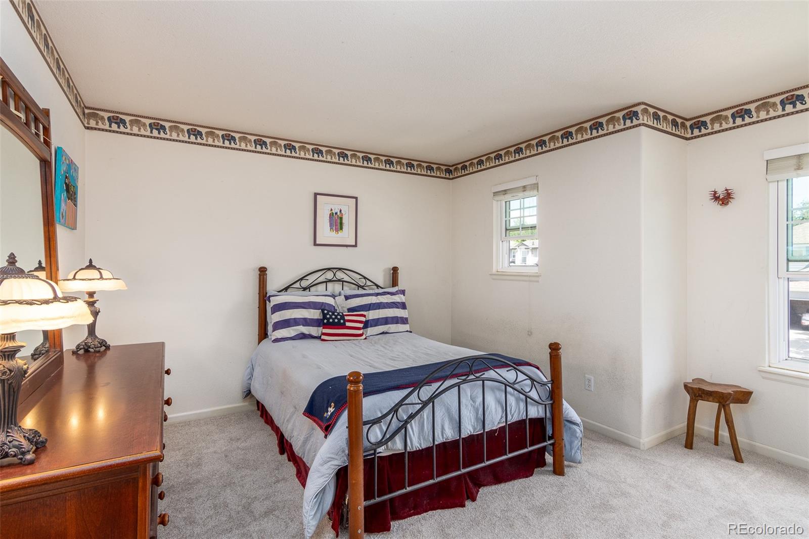 1082 Eldorado Drive Superior, CO 80027 - Photo 20 of 40 a bedroom with a bed and a table in it